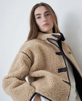 Giubbotto corto in shearling beige