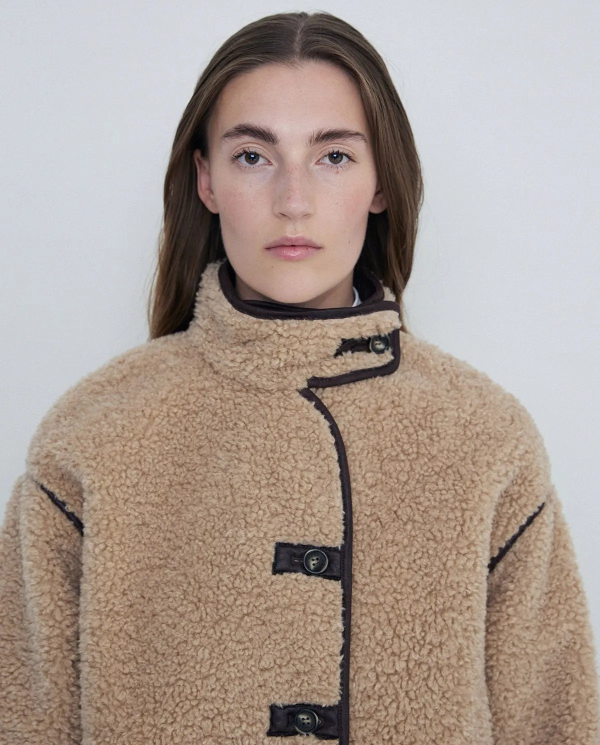 Giubbotto corto in shearling beige